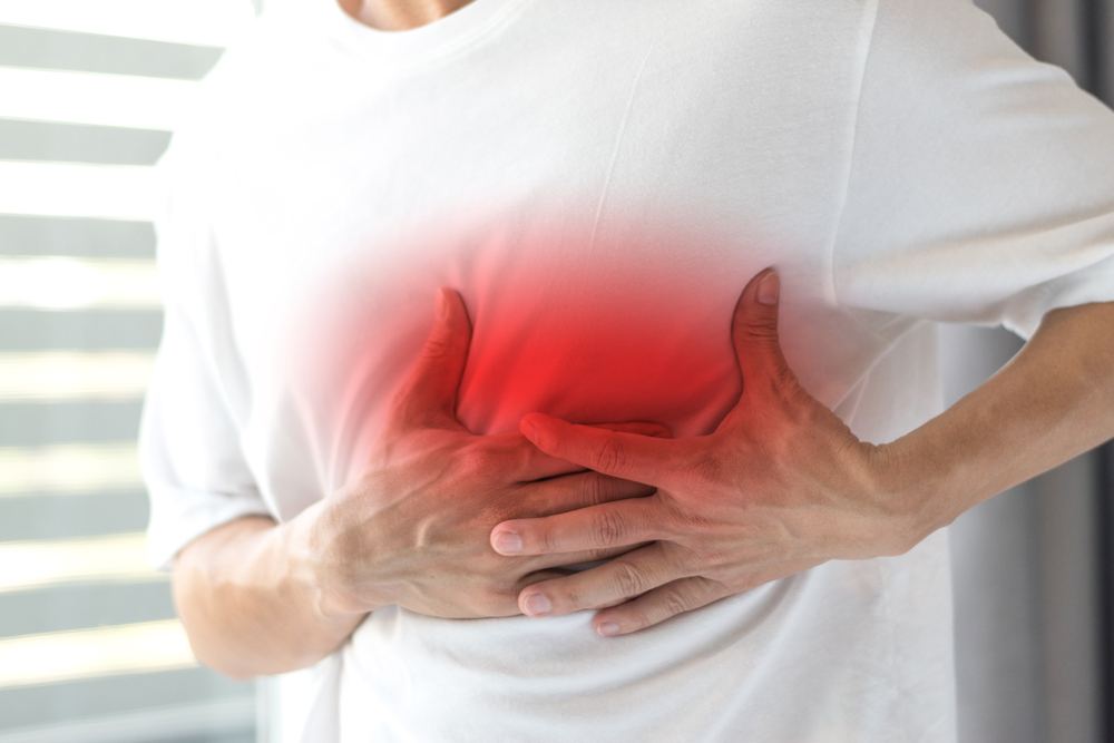 man with shingles pain on side