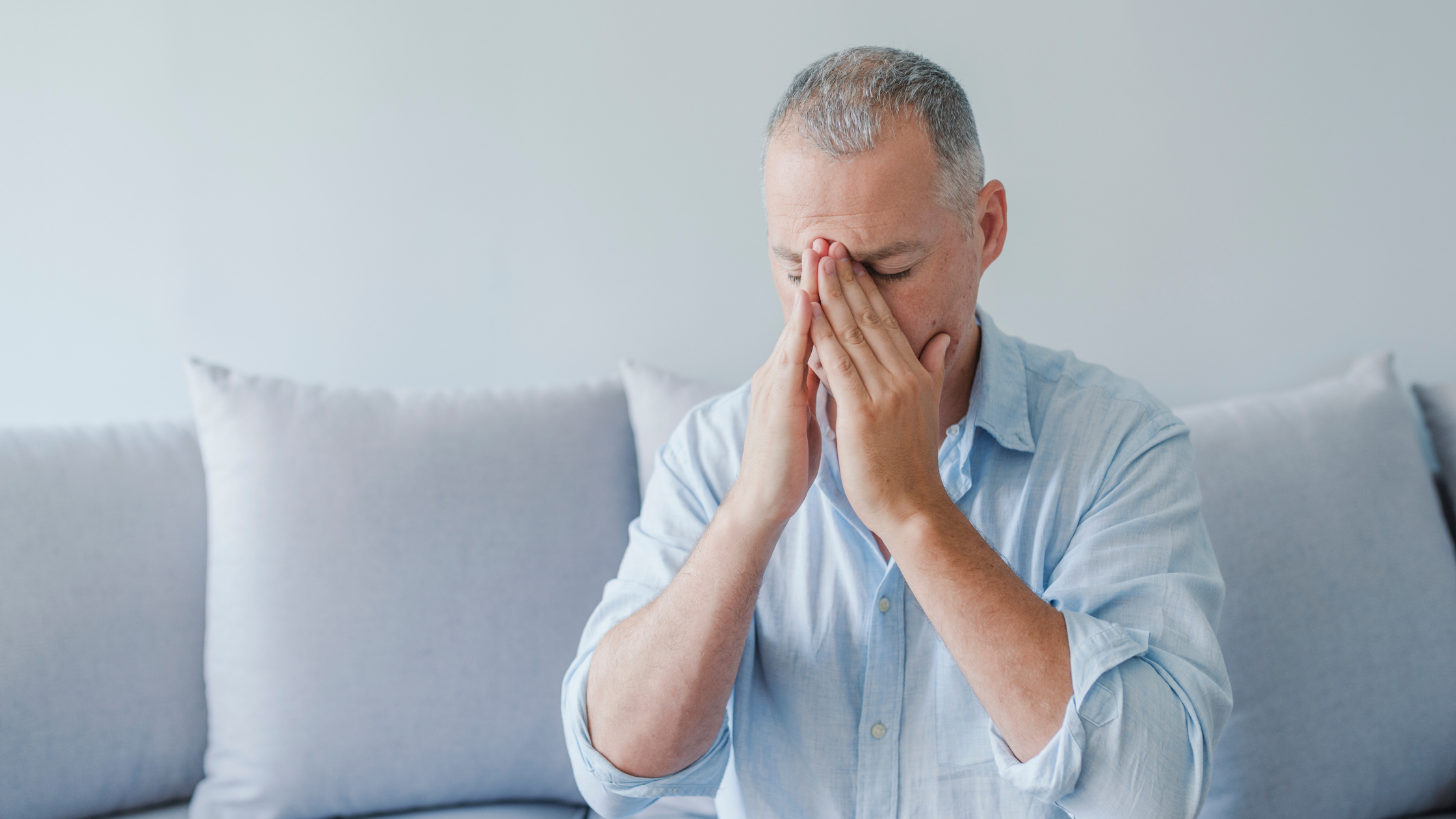 man in button down shirt with chronic migraines